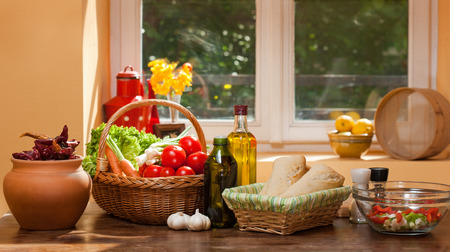 Assortment of fresh healthy groceries on display in the kitchen.の写真素材