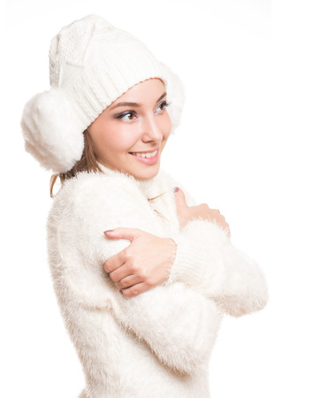 Cool brunette beauty in all white winter clothing.の写真素材