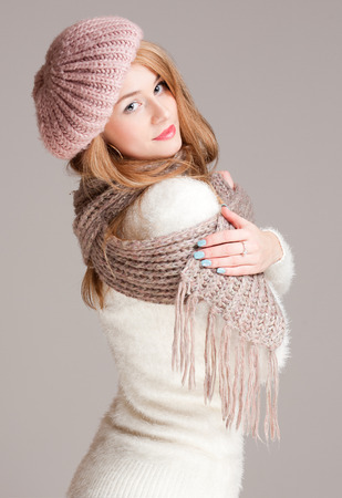 Portrait of a beautiful young woman in warm and cozy clothes.の写真素材