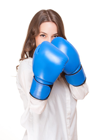 Portrait of gorgeous young brunette wearing blue boxing gloves.の写真素材