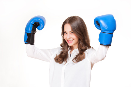 Portrait of brunette beauty in blue boxing gloves.の写真素材