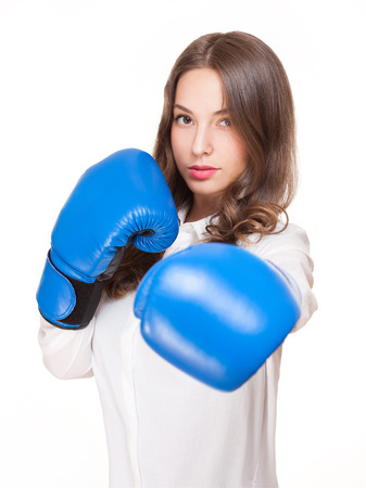 Portrait of brunette beauty in blue boxing gloves.の写真素材
