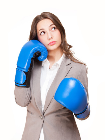 Portrait of young brunette beauty in blue boxing gloves.の写真素材