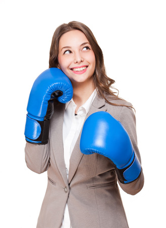 Portrait of a gorgeous brunette woman wearing boxing gloves.の写真素材