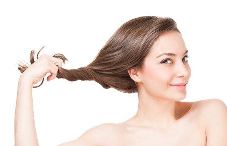 Portrait of a brunette beauty with strong healthy hair.の写真素材
