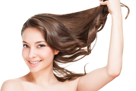 Portrait of a brunette beauty with strong healthy hair.の写真素材