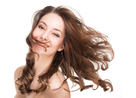 Portrait of a brunette beauty with strong healthy hair.の写真素材