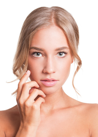 Portrait of a blond beauty with perfect tanned skin.の写真素材