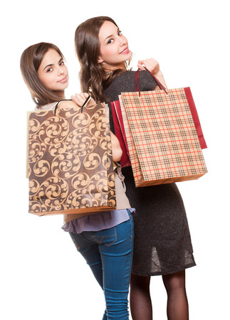 Couple of brunette beauties having shopping fun.の写真素材