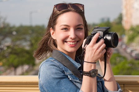 Gorgeous young brunette woman having photography fun.の写真素材