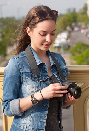 Gorgeous young brunette woman having photography fun.の写真素材