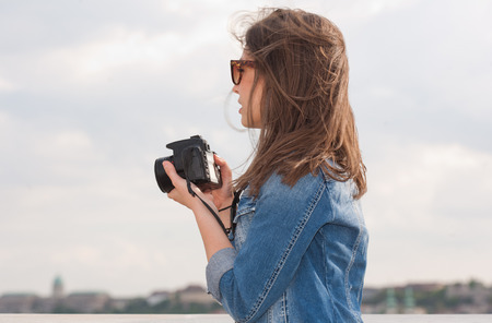 Gorgeous young brunette woman having photography fun.の写真素材