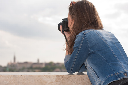 Gorgeous young brunette woman having photography fun.の写真素材