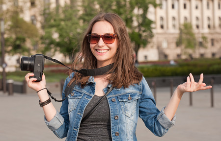 Gorgeous young brunette woman having photography fun.の写真素材