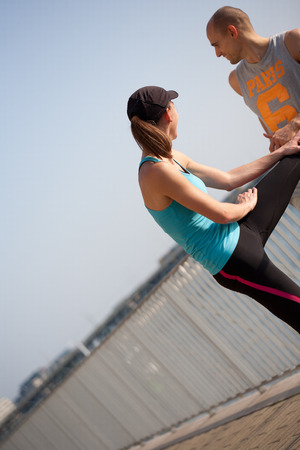 Very fit couple having running fun outdoors.の写真素材