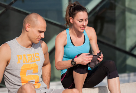 Very fit couple having running fun outdoors.の写真素材