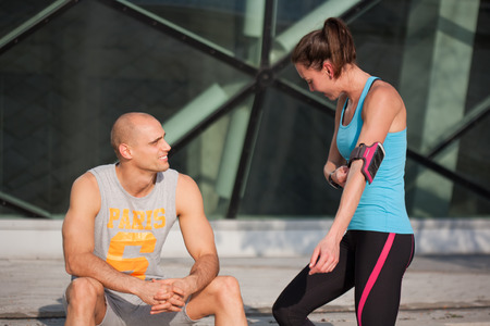 Very fit couple having running fun outdoors.の写真素材