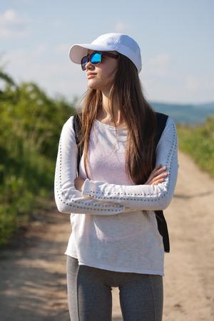 Walking is the most natural exercise, brunette beauty hiking.の写真素材
