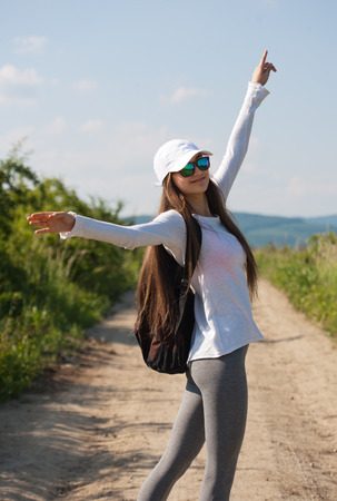 Walking is the most natural exercise, brunette beauty hiking.の写真素材