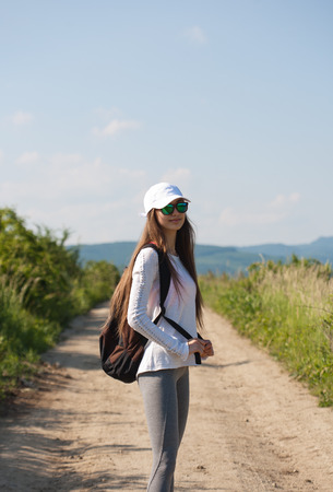 Walking is the most natural exercise, brunette beauty hiking.の写真素材