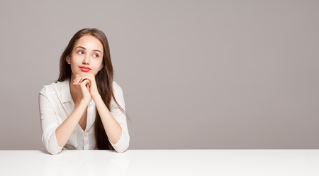 Portrait of a gorgeous young pensive brunette woman.の写真素材