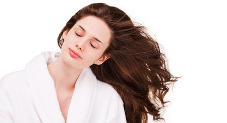 Portrait of a gorgeous young brunette woman with amazing full hair.の写真素材