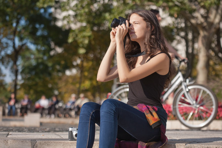 Pretty young photographer girl sporting both digital and analog cameras.の写真素材