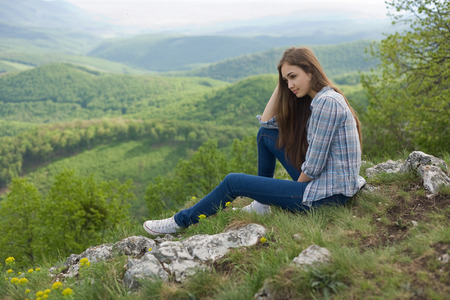 Thoughtful gorgeous young brunette enjoying the view.の写真素材