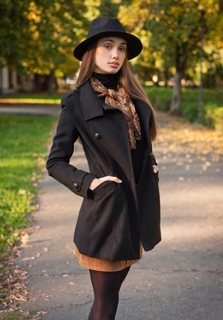 Outdoors portrait of a brunette autumn fashion beauty.の写真素材