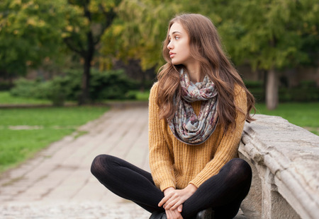 Outdoors portrait of a brunette autumn fashion beauty.の写真素材