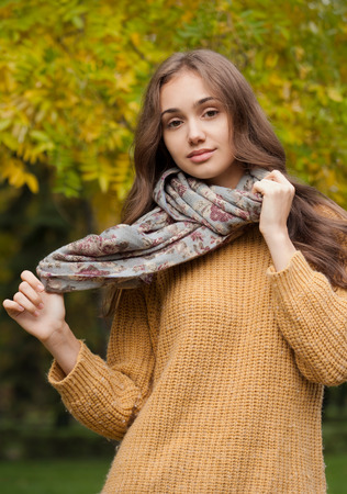 Outdoors portrait of a brunette autumn fashion beauty.の写真素材