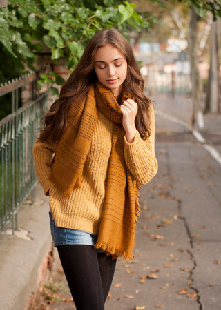 Outdoors portrait of a brunette autumn fashion beauty.の写真素材