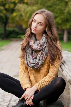 Outdoors portrait of a brunette autumn fashion beauty.の写真素材