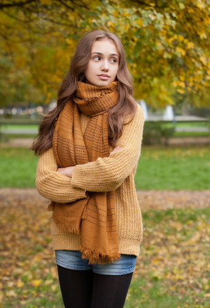 Outdoors portrait of a brunette autumn fashion beauty.の写真素材