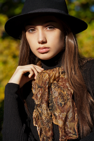 Outdoors portrait of a brunette autumn fashion beauty.の写真素材