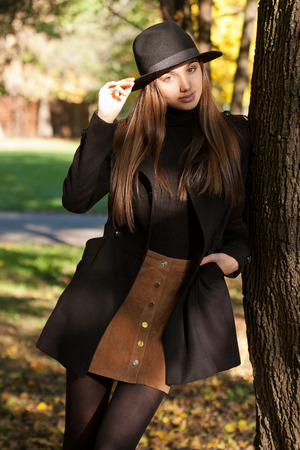 Outdoors portrait of a brunette autumn fashion beauty.の写真素材