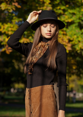 Outdoors portrait of a brunette autumn fashion beauty.の写真素材