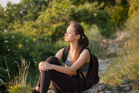 Portrait of a gorgeous young woman having hiking fun outdoors in nature.の写真素材