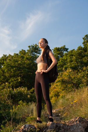 Portrait of a fit fit young brunette woman outdoors.の写真素材