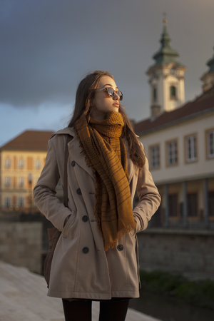 Outdoors portrait of a beautiful autumn fashion beauty.の写真素材