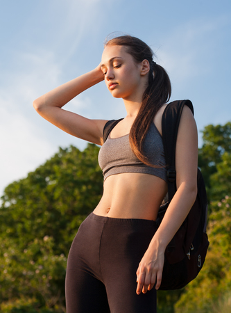 Portrait of a gorgeous young woman having hiking fun outdoors in nature.の写真素材