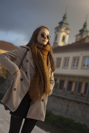 Outdoors portrait of a beautiful autumn fashion beauty.の写真素材