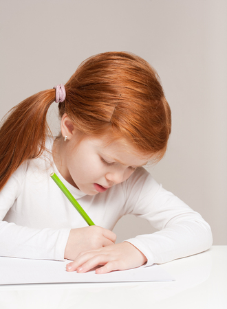 Portrait of beautiful young redhead girl with creative toys.の写真素材
