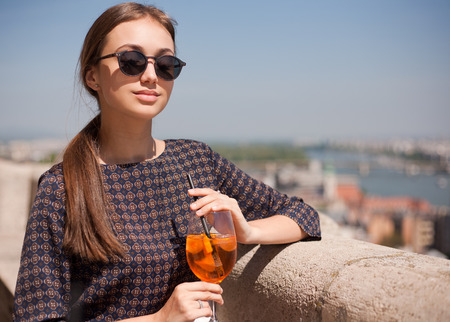 Outdoors portrait of happy young brunette tourist woman.の写真素材