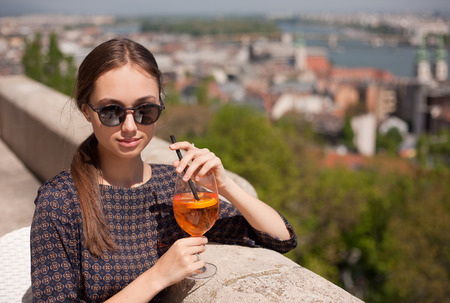 Portrait of a young gorgeous tourist woman enjoying the view.の写真素材