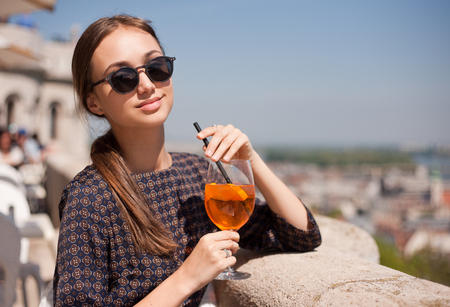 Portrait of a young gorgeous tourist woman enjoying the view.の写真素材