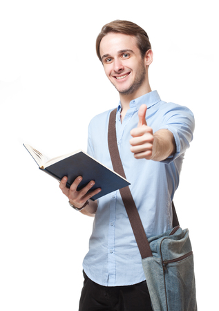 Portrait of a friendly smiling handsome young brunette man.の写真素材