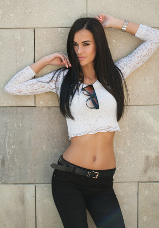 Portrait of stylish brunette fashionable summer beauty outdoors.の写真素材