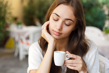 Portrait of a gorgeous young woman having gourmet fun in restaurant.の写真素材