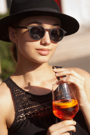Outdoors summer portrait of a gorgeous young brunette model.の写真素材